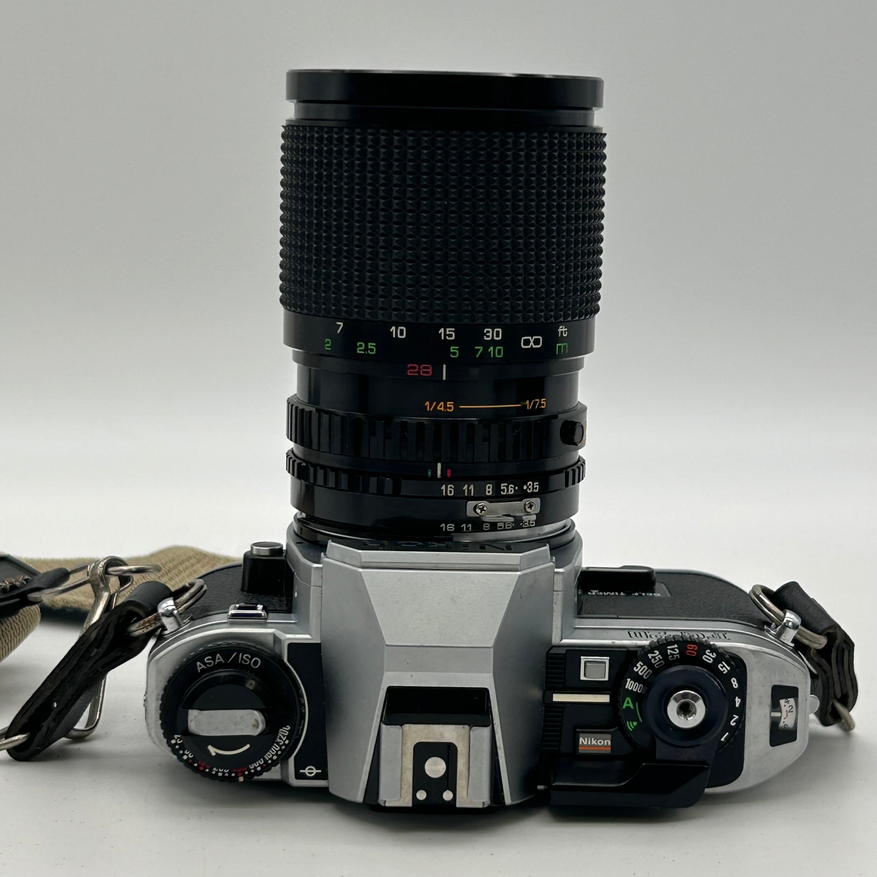 Nikon FG-20 35mm SLR Film Camera Bundle w/ 2 Lenses (Rokinon, Sigma) - Untested