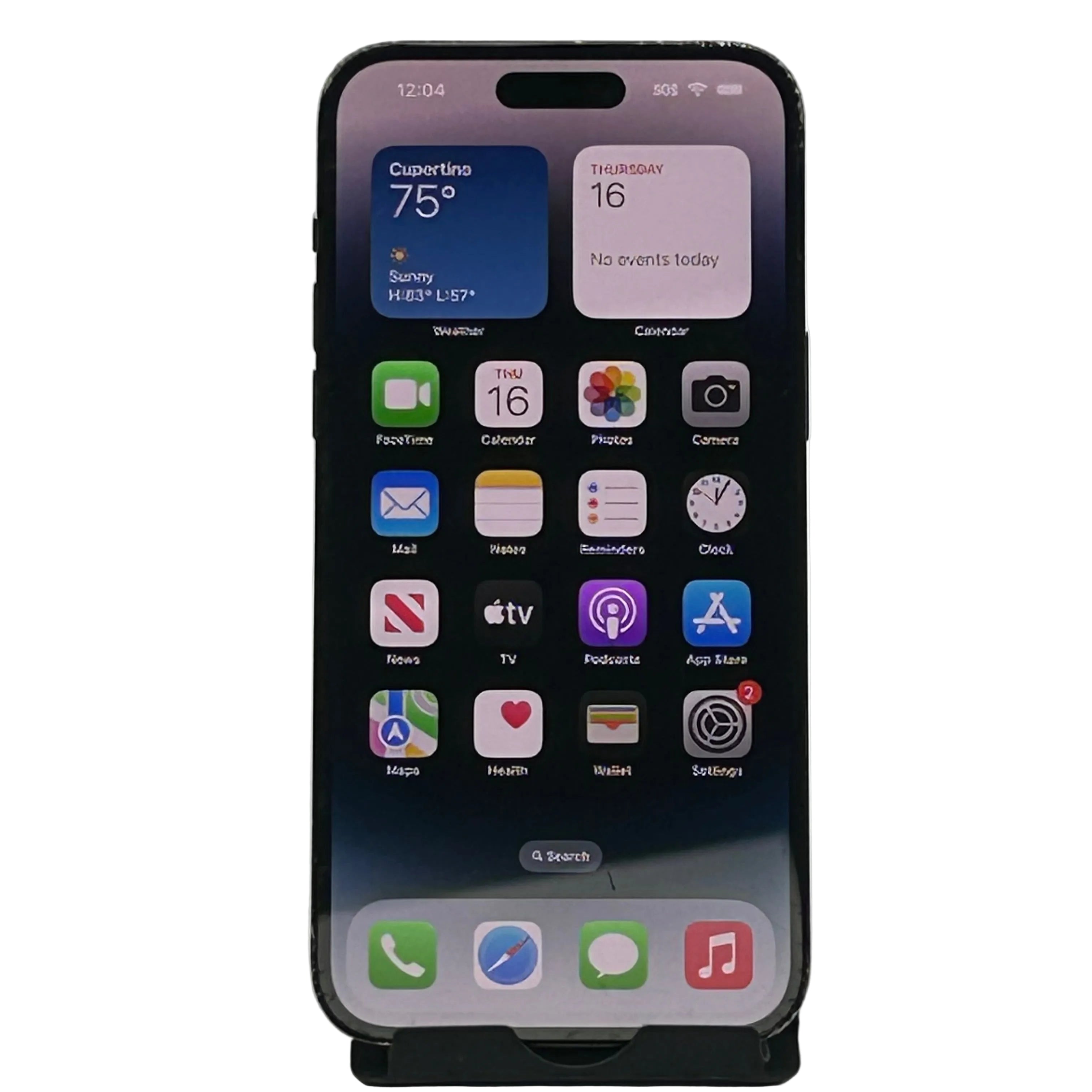 A black smartphone shown upright on a small stand against a light gray background. The screen is on and displaying the iOS home screen with app icons including FaceTime, Calendar, Photos, Camera, Mail, Notes, Clock, Podcasts, App Store, Maps, Health, Wallet, Settings, Phone, Safari, Messages, and Music.