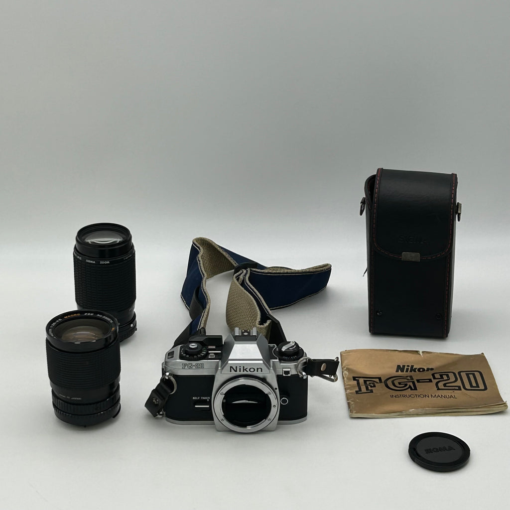 Nikon FG-20 35mm SLR Film Camera Bundle w/ 2 Lenses (Rokinon, Sigma) - Untested