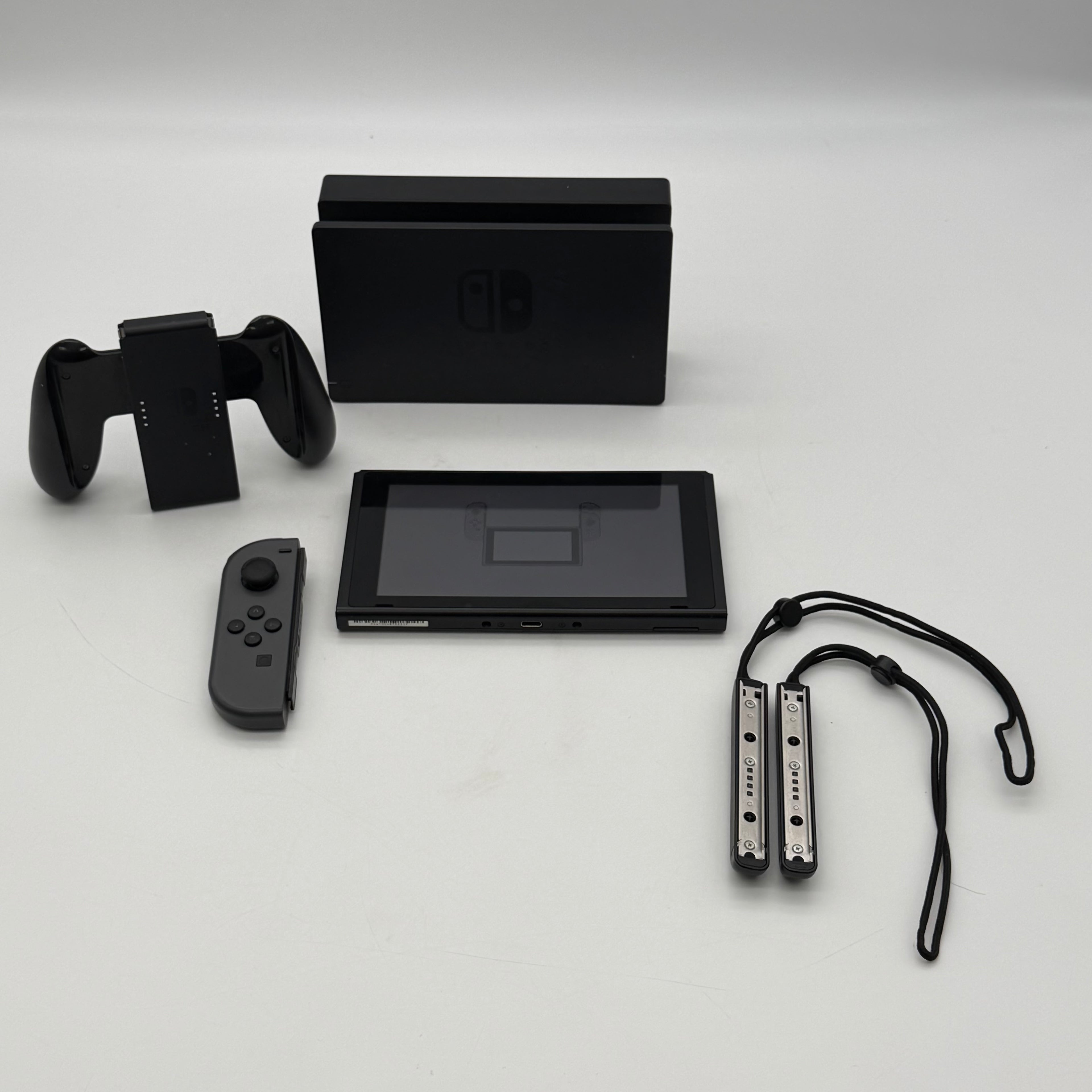 Nintendo Switch 2019 HAC-001-01 Black 64GB Console Bundled - One Joy-Con Controller, Dock, Joy Con Holder