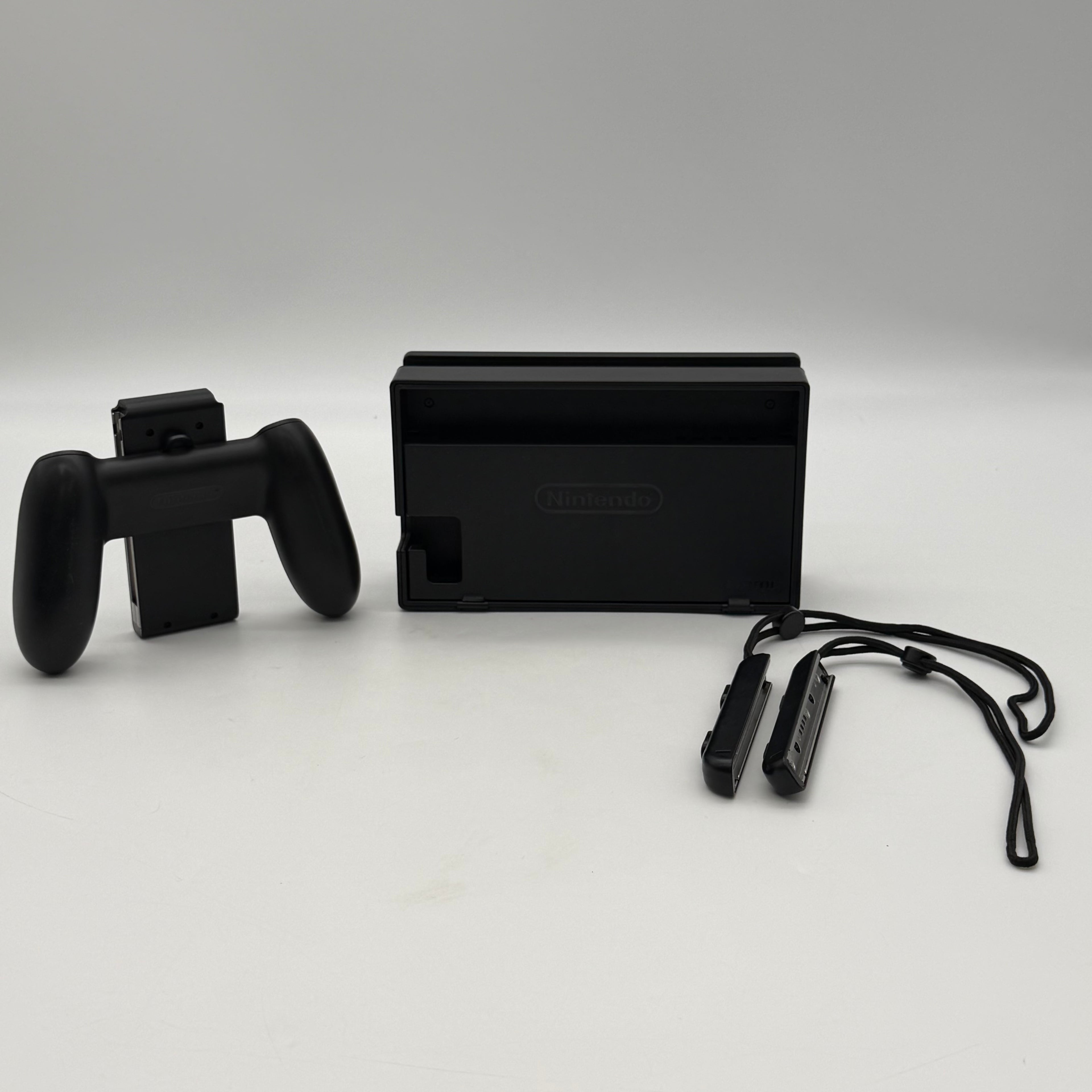 Nintendo Switch 2019 HAC-001-01 Black 64GB Console Bundled - One Joy-Con Controller, Dock, Joy Con Holder