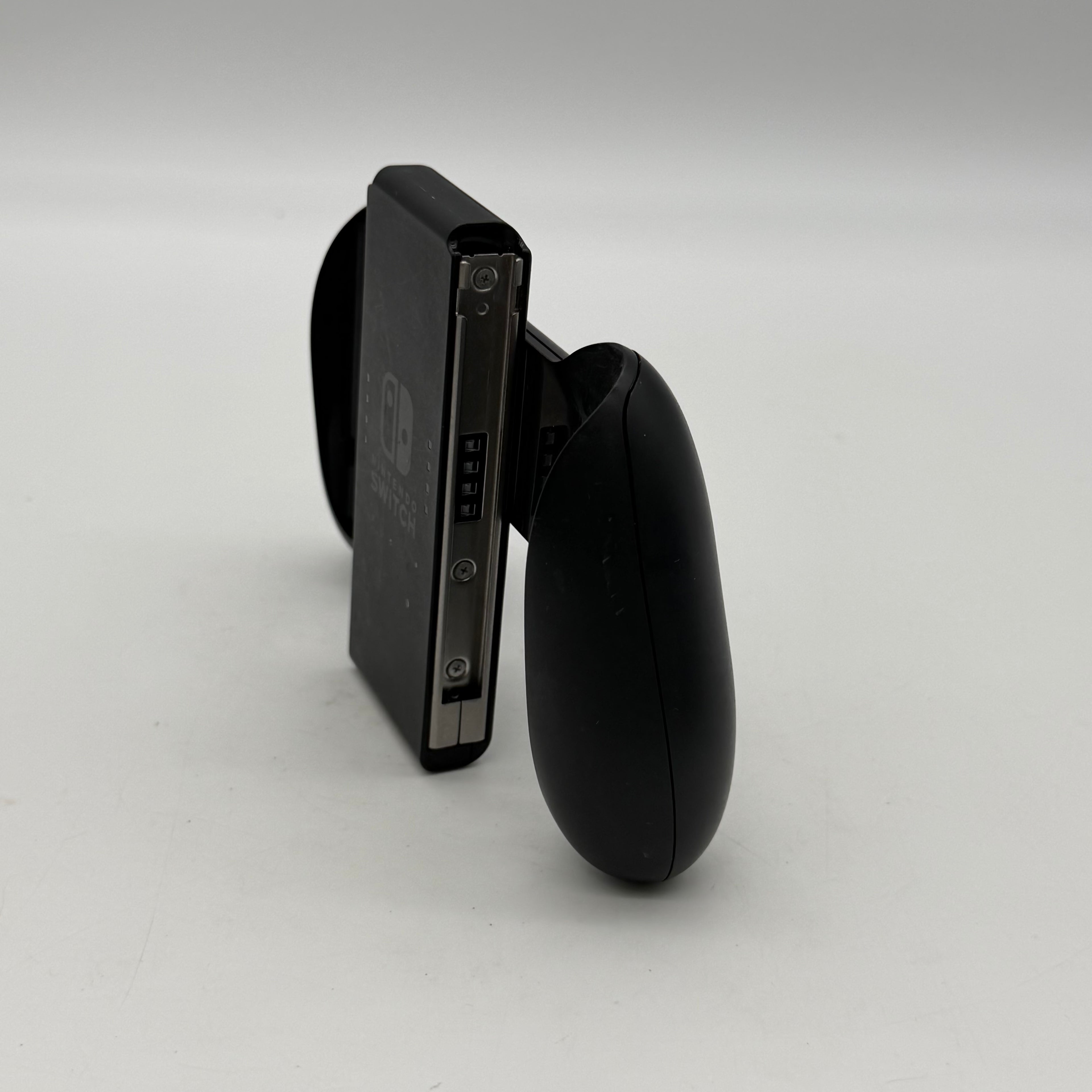 Nintendo Switch 2019 HAC-001-01 Black 64GB Console Bundled - One Joy-Con Controller, Dock, Joy Con Holder